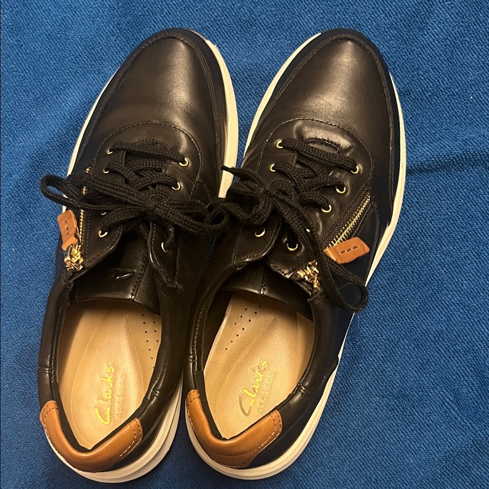 Clarks Black Leather Sneakers with Tan Heel and Zip Accents